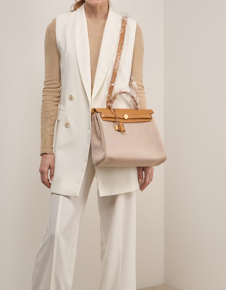 Hermès Herbag 31 Toile / Vache Hunter Écru / Beige on Model | Sell your designer bag