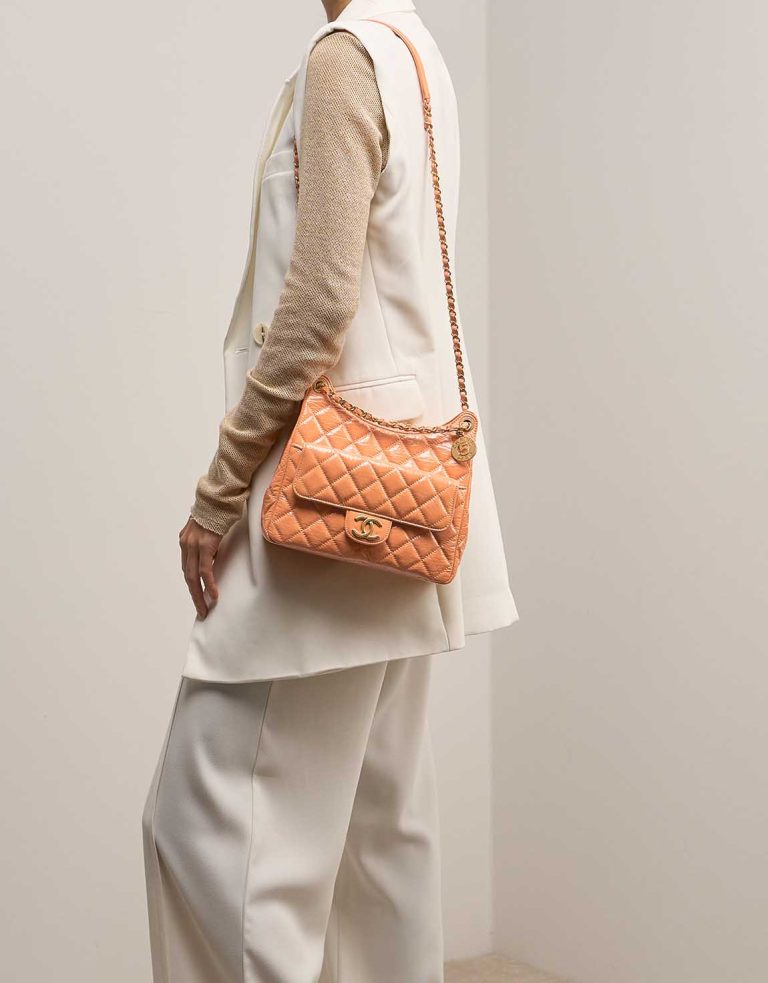 Chanel Hobo Aged Calf Orange on Model | Sell your designer bag