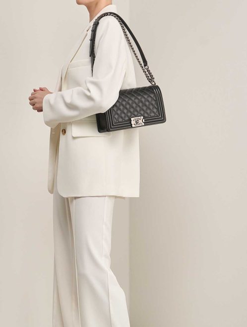 Chanel Boy Medium Caviar Black on Model | Sell your designer bag