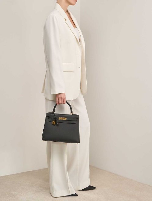 Hermès Kelly 28 Veau Madame Black on Model | Sell your designer bag