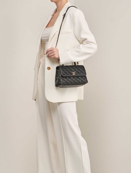 Chanel Timeless Handle Small Caviar Black on Model | Sell your designer bag