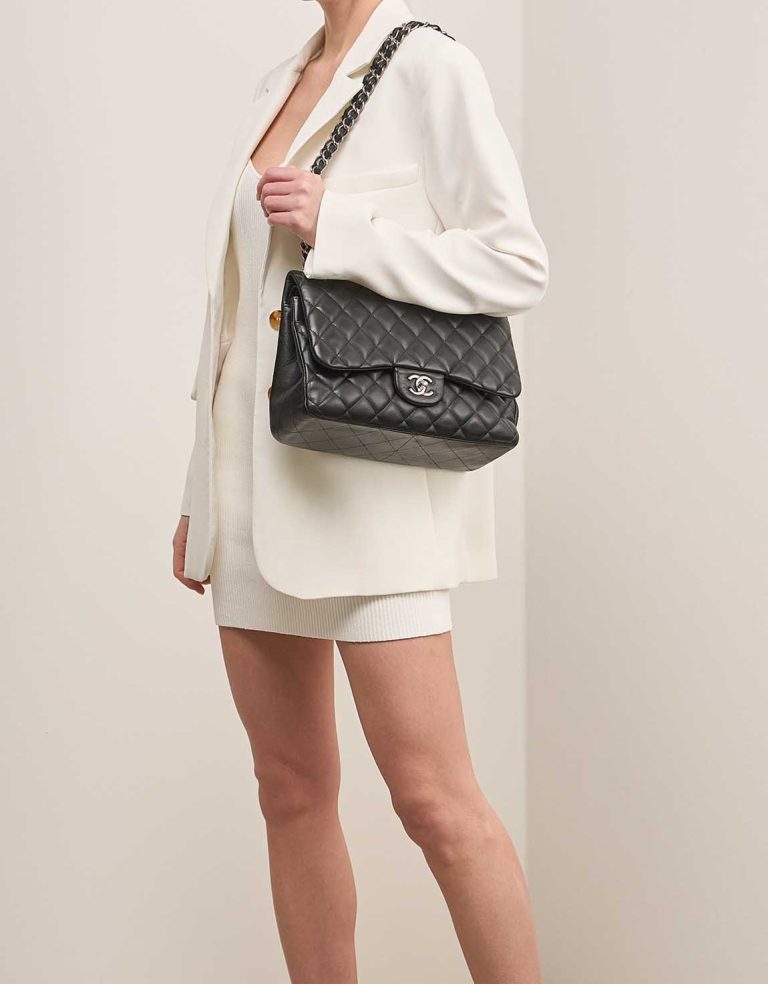 Chanel Timeless Jumbo Lamb Black on Model | Sell your designer bag