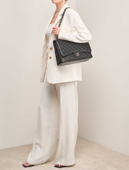 Chanel Timeless Maxi Caviar Black on Model | Sell your designer bag
