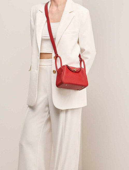 Hermès Lindy Mini Clémence Rouge Vermillon on Model | Sell your designer bag