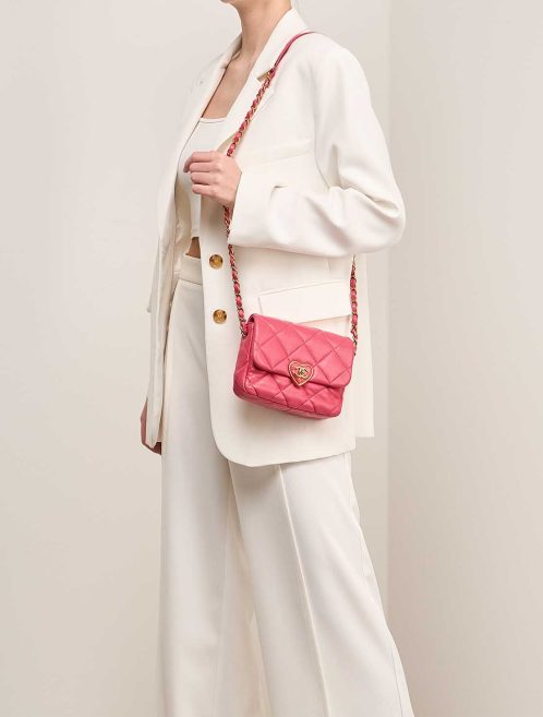 Chanel Coco Love Flap Bag Mini Lamb Pink on Model | Sell your designer bag