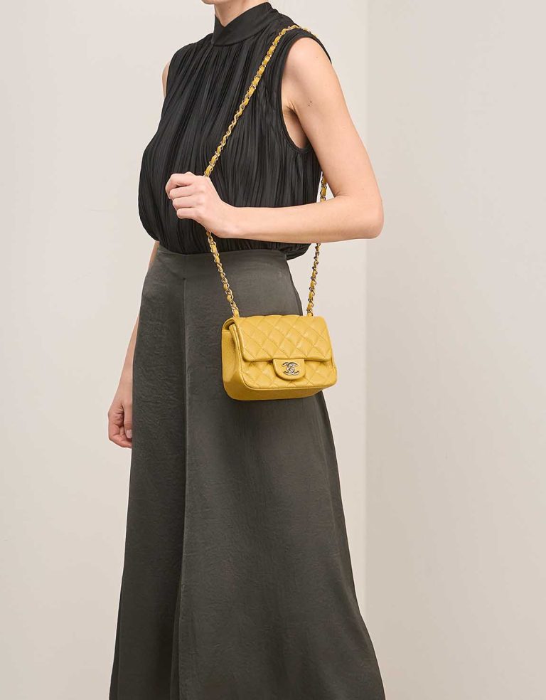 Chanel Timeless Mini Square Caviar Yellow on Model | Sell your designer bag