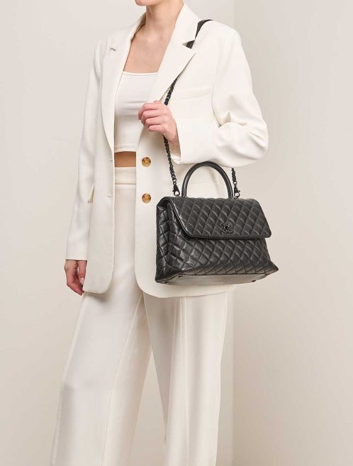 Chanel Timeless Handle Large Caviar So Black on Model | Sell your designer bag