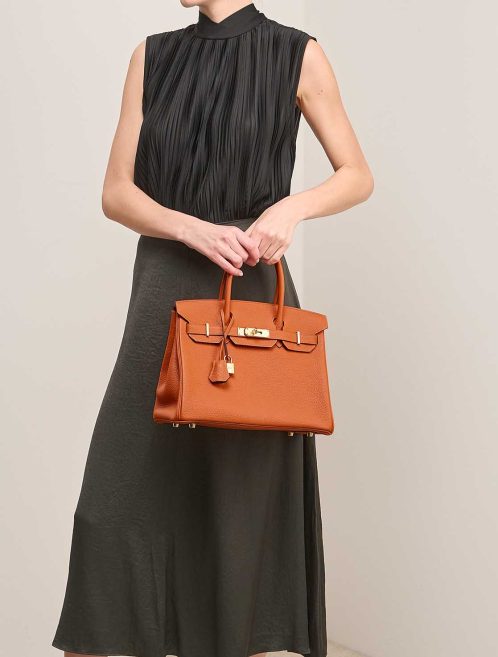 Hermès Birkin 30 Togo Orange  on Model | Sell your designer bag