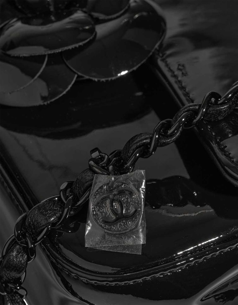 Chanel Camellia Flap Bag Small Patent Black Signs of wear | Sell your designer bag
