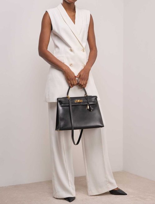 Hermès Kelly 35 Box Black on Model | Sell your designer bag