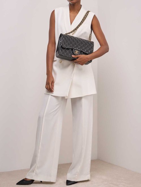 Chanel Timeless Jumbo Lamb Black on Model | Sell your designer bag
