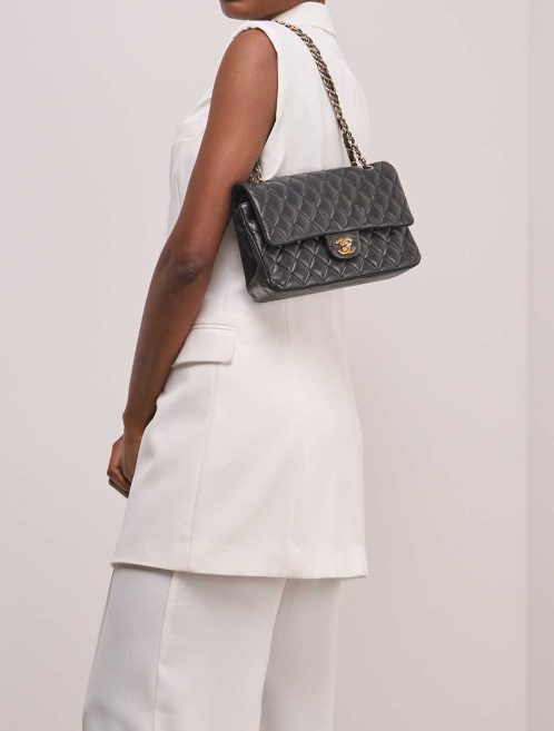 Chanel Timeless Medium Lamb Black on Model | Sell your designer bag