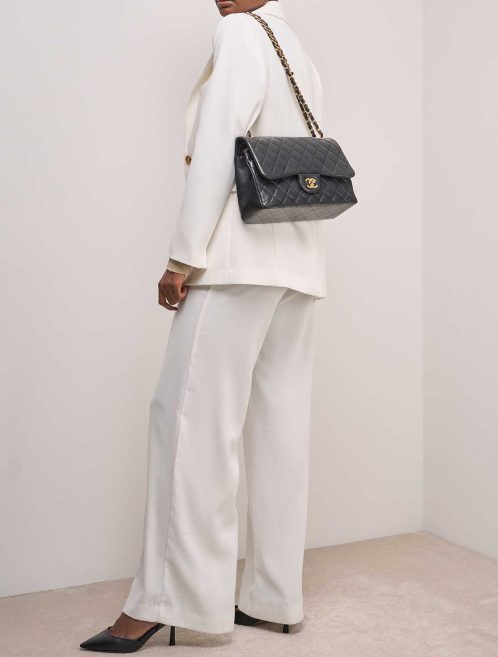 Chanel Timeless Jumbo Lamb Black on Model | Sell your designer bag