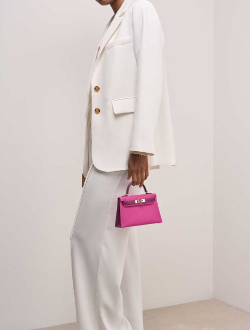 Hermès Kelly HSS Mini Chèvre Mysore Magnolia / Ultraviolet on Model | Sell your designer bag