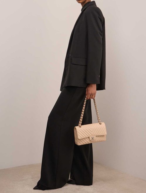 Chanel Timeless Chevron Medium Caviar Beige on Model | Sell your designer bag