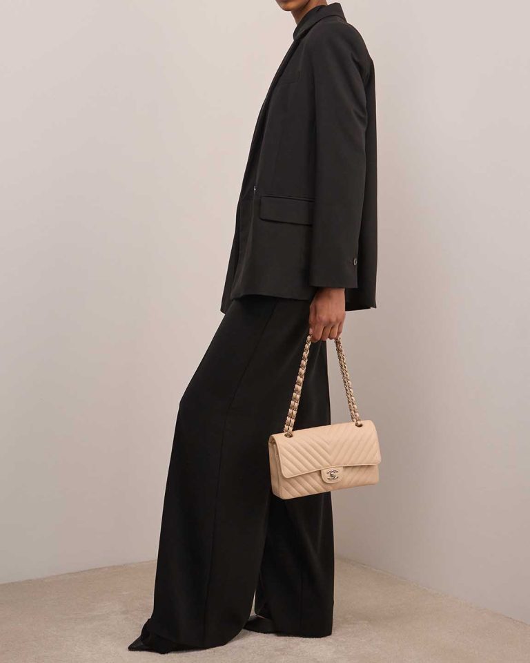 Chanel Timeless Chevron Medium Caviar Beige on Model | Sell your designer bag