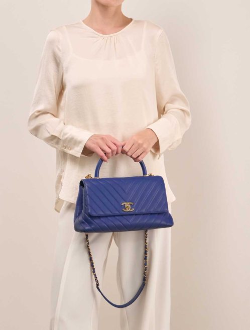 Chanel Timeless Handle Chevron Medium Caviar Deep Blue on Model | Sell your designer bag