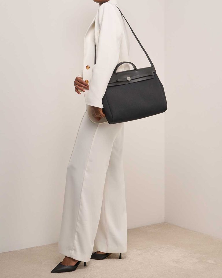 Hermès Herbag 39 Toile / Vache Hunter Noir on Model | Sell your designer bag