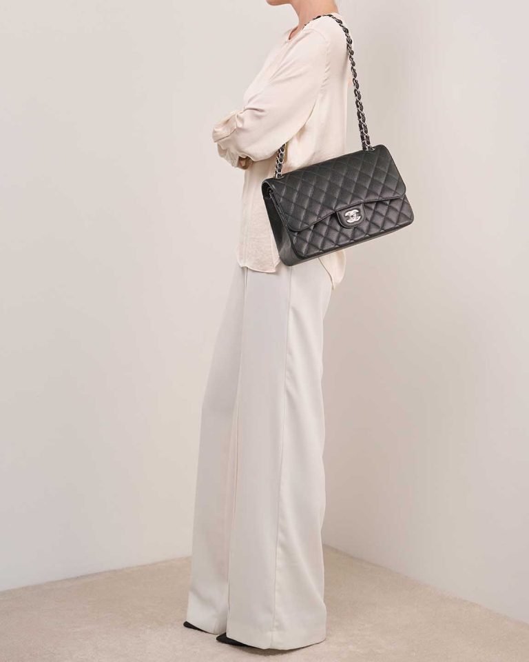 Chanel Timeless Jumbo Caviar Black on Model | Sell your designer bag