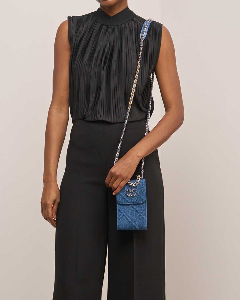 Chanel 19 Phone Holder Denim Blue on Model | Sell your designer bag