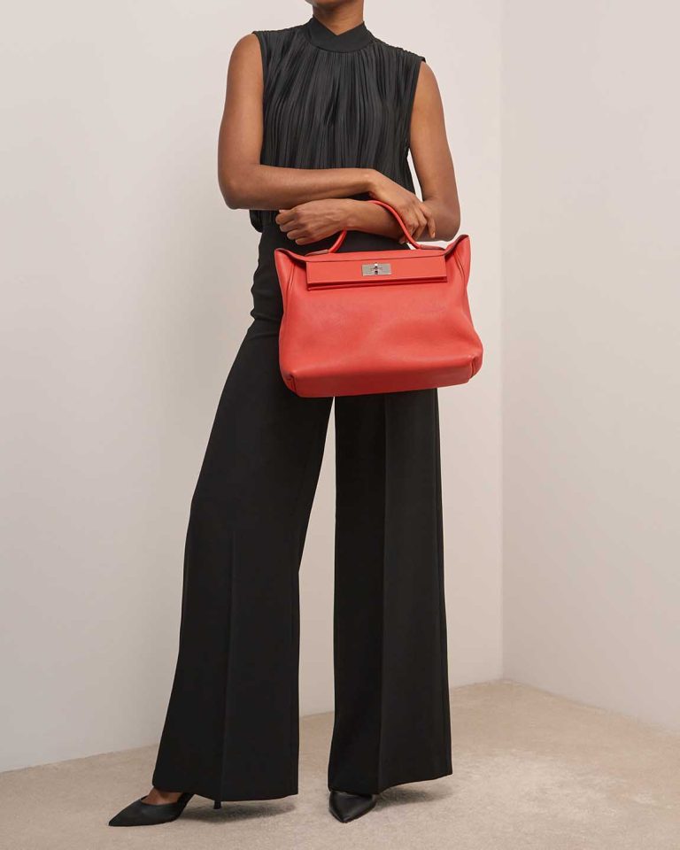 Hermès 24/24 35 Swift / Taurillon Clémence Capucine on Model | Sell your designer bag