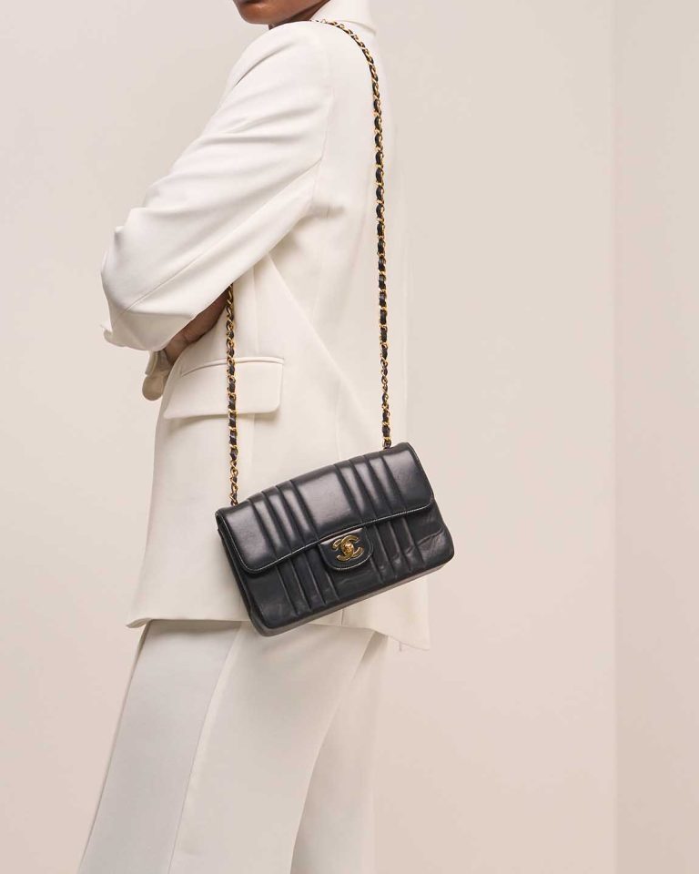 Chanel Timeless Small Lamb Dark Blue on Model | Sell your designer bag