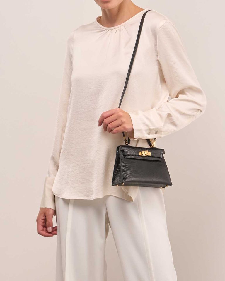 Hermès Kelly Mini Niloticus Lizard Black on Model | Sell your designer bag