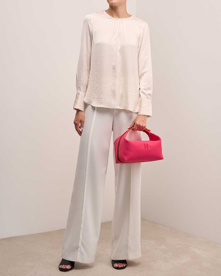Hermès Bride-à-Brac Canvas Rouge H / Orange H / Hibiscus on Model | Sell your designer bag