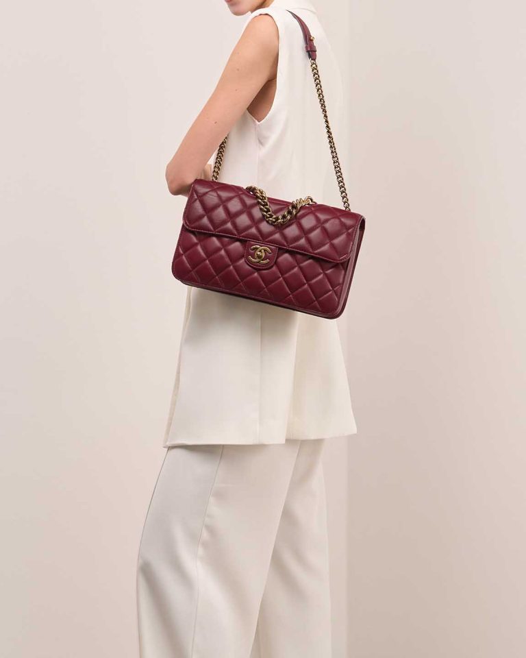 Chanel Timeless Jumbo Lamb Bordeaux on Model | Sell your designer bag