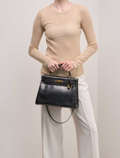Hermès Kelly 32 Box Black on Model | Sell your designer bag