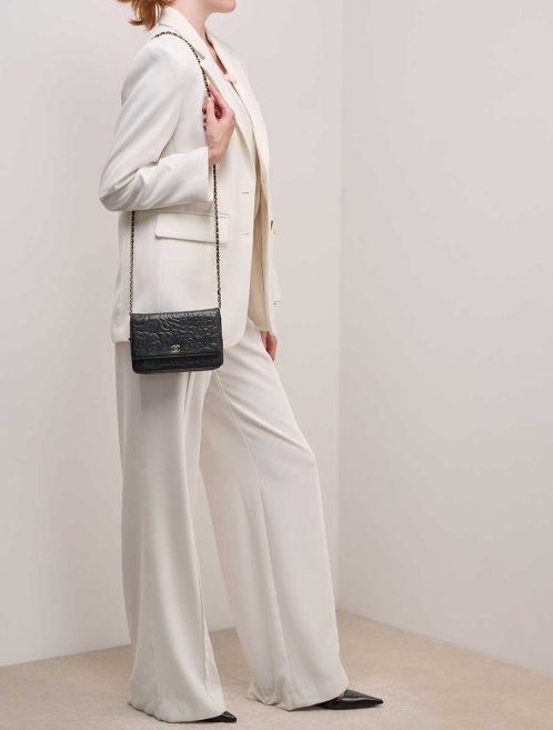 Chanel Wallet On Chain Camellia Lamb Black on Model | Sell your designer bag