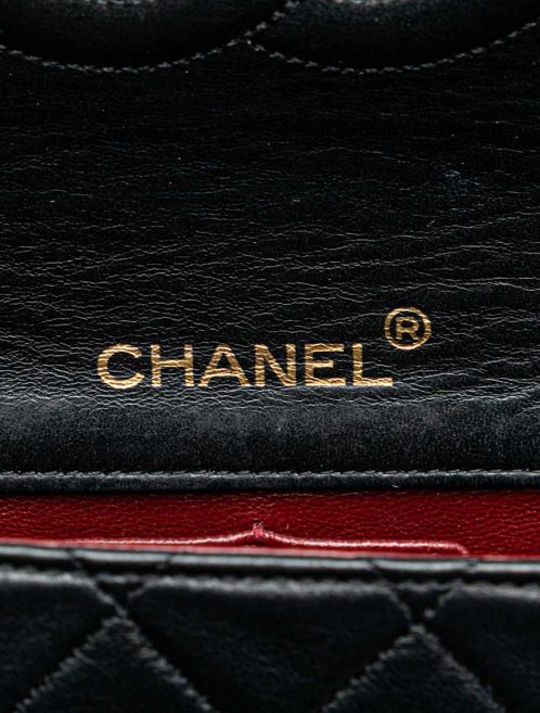 Chanel Flap Bag Mini Lamb Black Logo | Sell your designer bag