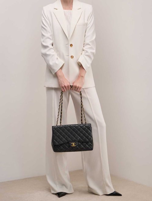 Chanel Timeless Jumbo Caviar Black on Model | Sell your designer bag