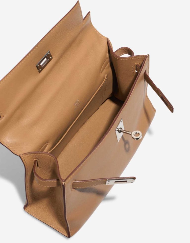 Hermès Kelly Pochette Swift Biscuit Inside | Sell your designer bag