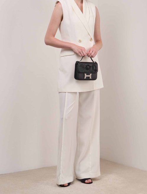Hermès Constance Dancing Flowers 18 Swift Black on Model | Sell your designer bag