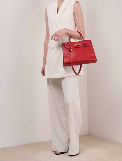 Hermès Kelly 32 Courchevel Rouge Vif on Model | Sell your designer bag