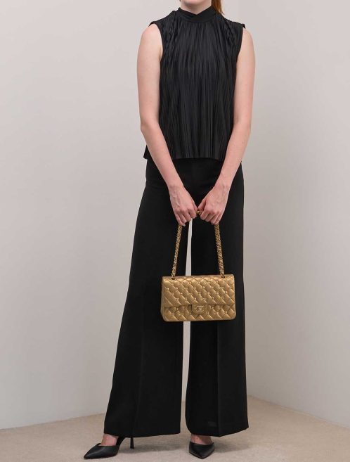 Chanel Timeless Medium Lamb Metallic Gold on Model | Sell your designer bag