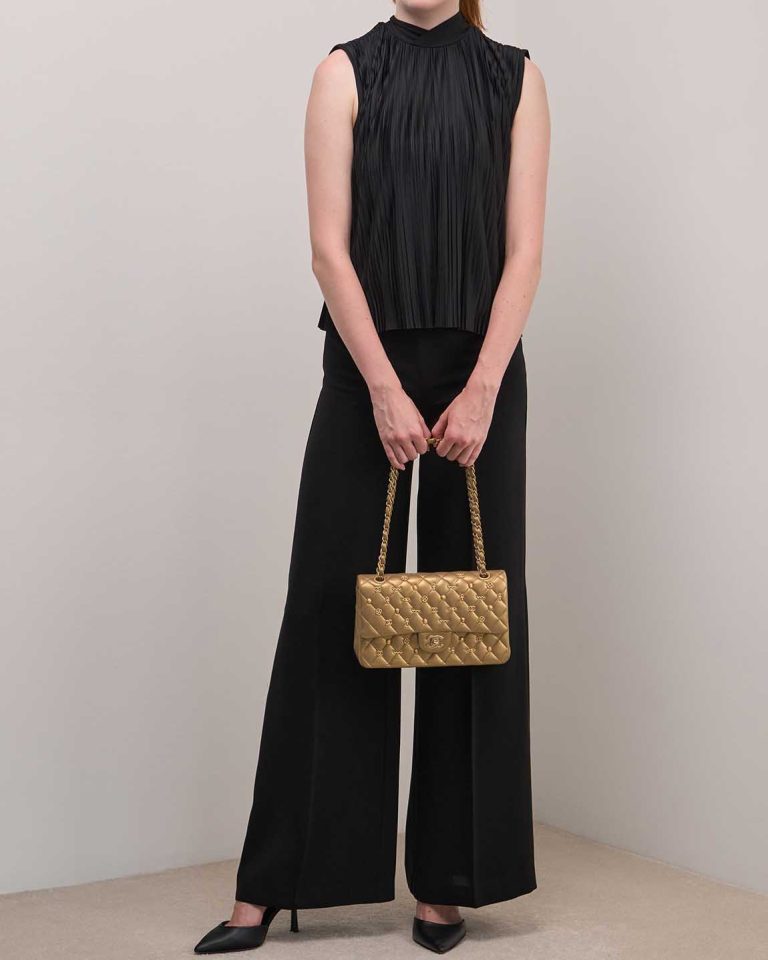 Chanel Timeless Medium Lamb Metallic Gold on Model | Sell your designer bag