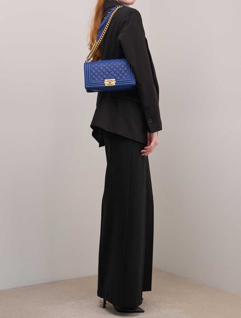 Chanel Boy Medium Caviar Blue on Model | Sell your designer bag