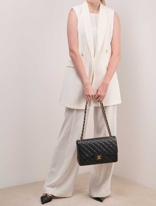 Chanel Timeless Jumbo Caviar Black on Model | Sell your designer bag