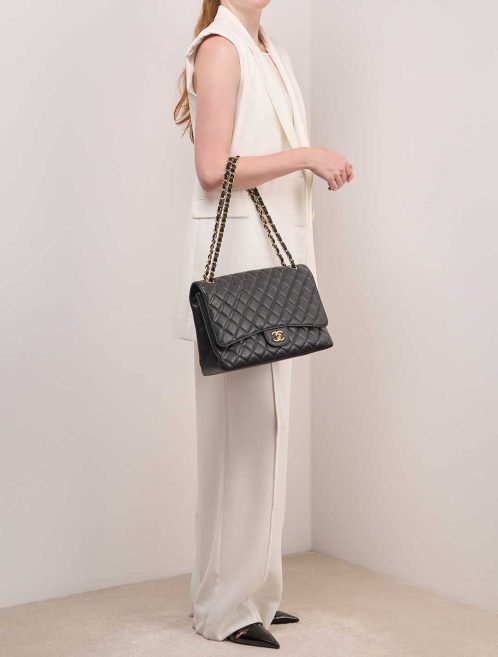 Chanel Timeless Maxi Caviar Black on Model | Sell your designer bag