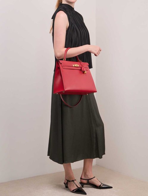 Hermès Kelly 35 Tadelakt Rouge Vif on Model | Sell your designer bag