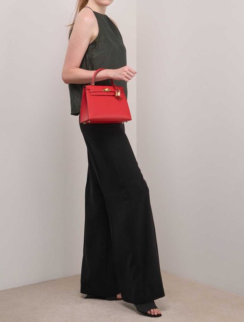 Hermès Kelly 25 Rouge Radieux on Model | Sell your designer bag