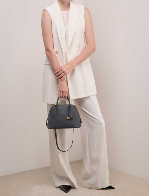 Hermès Bolide 25 Evercolor Gris Misty / Black on Model | Sell your designer bag
