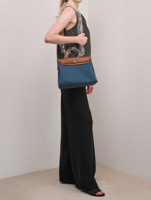 Hermès Herbag 31 Toile / Vache Hunter Bleu Tempete / Fauve on Model | Sell your designer bag