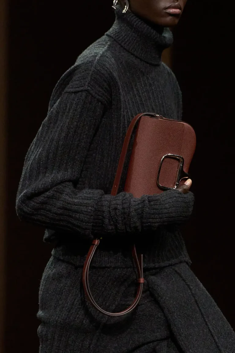 Brown Hermès clutch with sleek metal detail