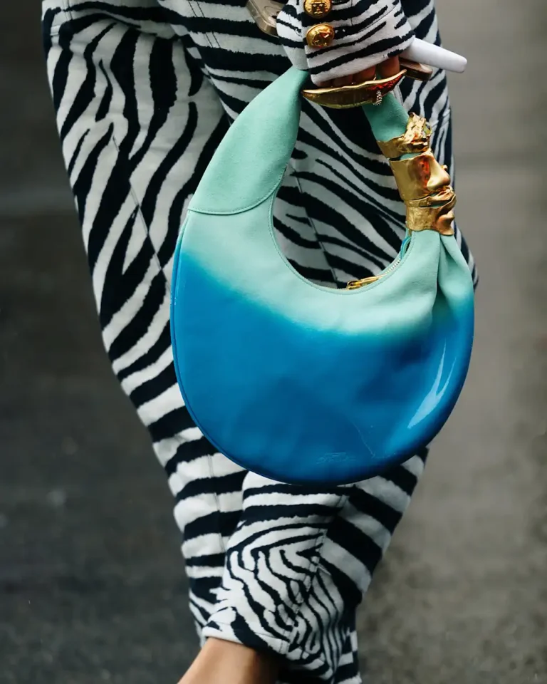 Balmain round hobo bag in turquoise-blue gradient with sculptural gold handle
