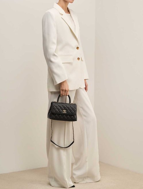 Chanel Timeless Handle Small Caviar Black on Model | Sell your designer bag