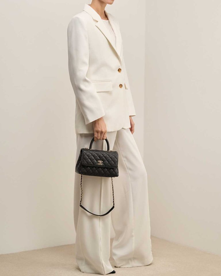 Chanel Timeless Handle Small Caviar Black on Model | Sell your designer bag