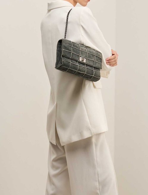 Chanel 2.55 Reissue 225 Suede Black on Model | Sell your designer bag